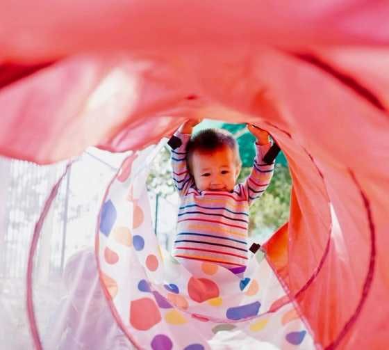 Toddler having fun in a tube!