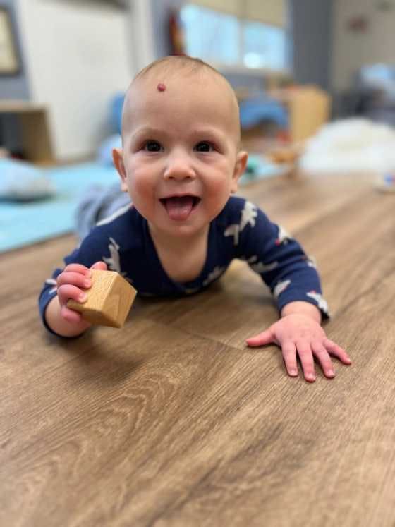 Preschool student in Branchburg playing with a block