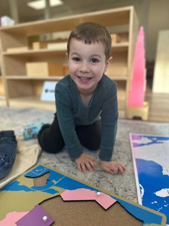 A kindergarten student working on a map at Guidepost Montessori at Branchburg. 